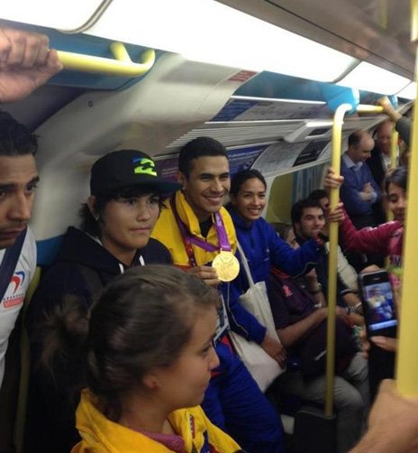 Ruben Limardo posed with his gold medal for fellow DLR passengers